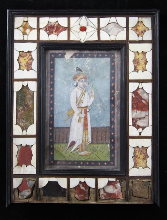 An Indian gouache miniature of a boy and parrot in a garden Overall 11 x 8.75in.